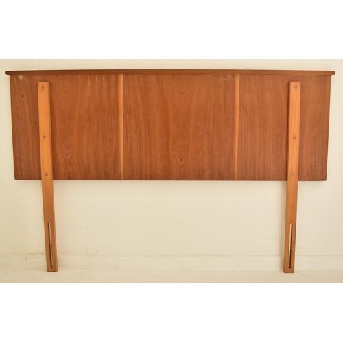 194 - Alfred Cox for AC Furniture - A mid 20th century walnut double bed headboard. Single panel with corn... 