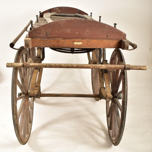 200 - A late 19th century Victorian bier or coffin carriage. The bier of typical form having a slatted pla... 