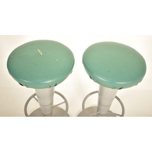 201 - A pair of vintage 20th century vinyl top & metal adjustable bar stool seats. Each stool having an aq... 