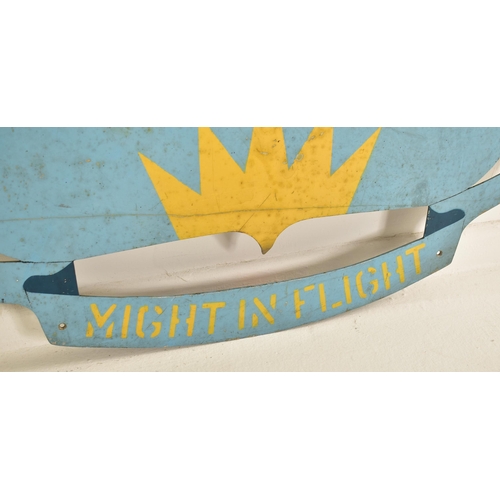 203 - Might In Flight - A vintage 20th century military emblem crest / sign. Metal construction painted in... 