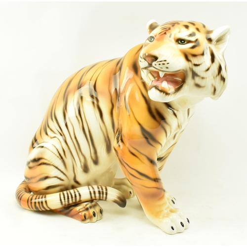 21 - A large 20th century 1960s Italian floor standing ceramic tiger. The tiger in the seated position wi... 