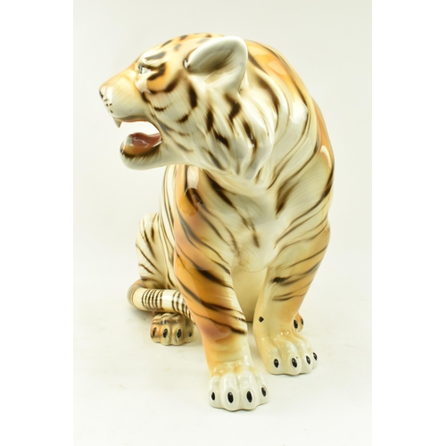 21 - A large 20th century 1960s Italian floor standing ceramic tiger. The tiger in the seated position wi... 