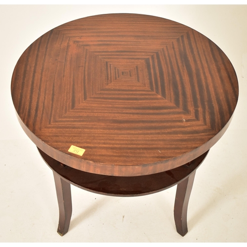 212 - A vintage mid 20th century circa 1950s walnut veneered circular low occasional coffee table. The tab... 