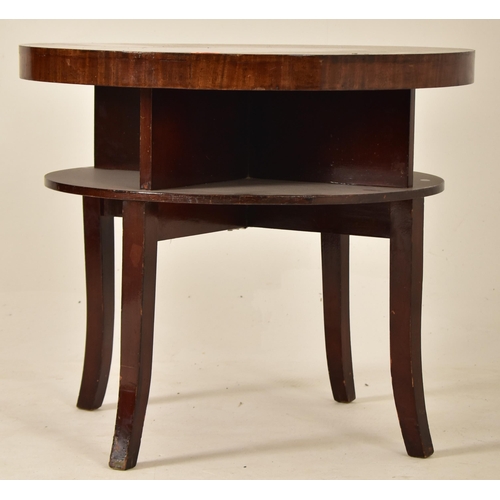 212 - A vintage mid 20th century circa 1950s walnut veneered circular low occasional coffee table. The tab... 