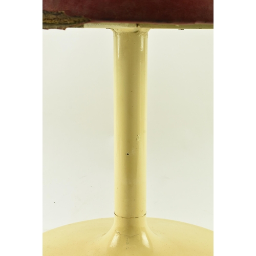 214 - A retro 20th century leather upholstered & metal Tulip manner stool. The stool having a circular pad... 