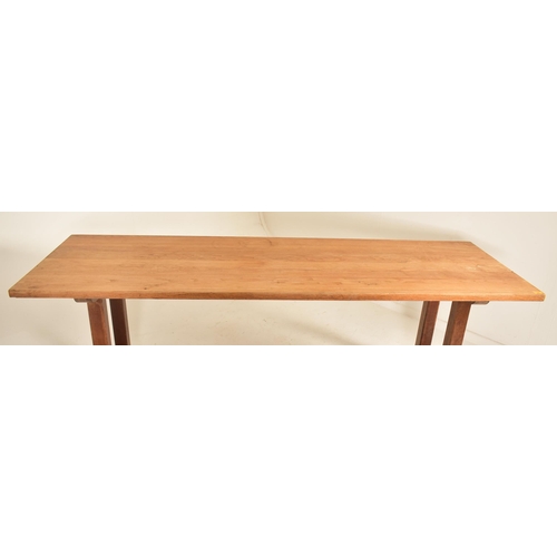 220 - A retro 20th century solid elm wood refectory farmhouse dining table. The table having a rectangular... 