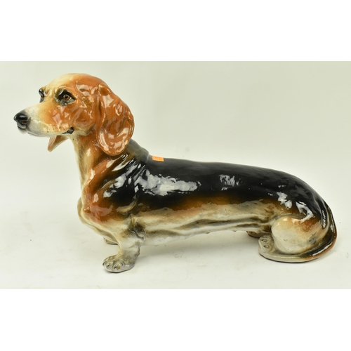24 - A large retro 20th century 1960s Italian glazed ceramic figurine of a Dachshund dog. Modelled in a s... 