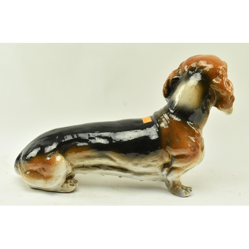 24 - A large retro 20th century 1960s Italian glazed ceramic figurine of a Dachshund dog. Modelled in a s... 