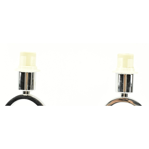 243 - A pair of contemporary high end design chrome metal abstract desk table lamps. Each having shaped ch... 