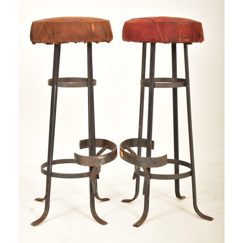 276 - A set of four retro 20th century suede leather & wrought iron bar stools. Each having a circular pad... 