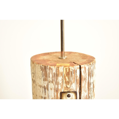 288 - A bespoke vintage late 20th century floor standing lamp built from a tree trunk. The lamp having a w... 