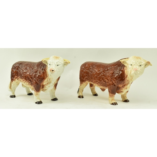 438 - Melbaware for H. A. Wain & Sons Ltd. - Two vintage 20th century pottery ceramic bull animal figurine... 