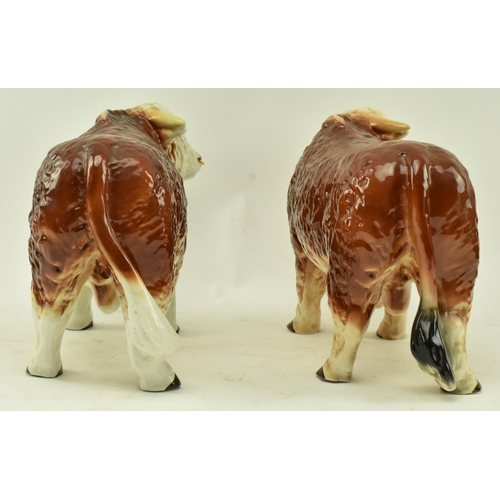 438 - Melbaware for H. A. Wain & Sons Ltd. - Two vintage 20th century pottery ceramic bull animal figurine... 