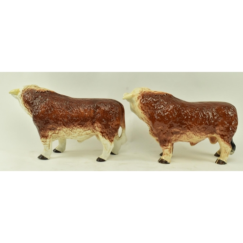 438 - Melbaware for H. A. Wain & Sons Ltd. - Two vintage 20th century pottery ceramic bull animal figurine... 