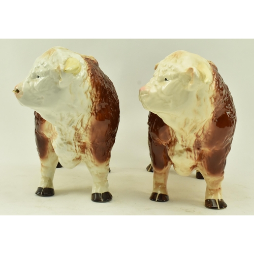 438 - Melbaware for H. A. Wain & Sons Ltd. - Two vintage 20th century pottery ceramic bull animal figurine... 