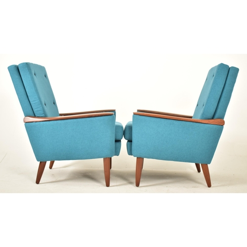 440 - Greaves & Thomas - A pair of retro 20th century circa 1970s teak easy lounge armchairs / chairs. Eac... 