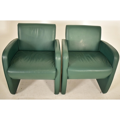 448 - A pair of retro 20th century Art Deco inspired green leather tub lounge armchairs. Each chair having... 