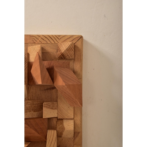 450 - An unusual vintage 20th century woodworked geometric panelled wall hanging. The wall hanging artwork... 