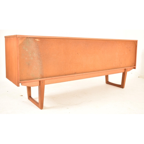 522 - A retro 20th century British modern designer teak sideboard credenza. The sideboard having a central... 