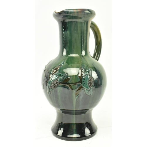 57 - Sir Edmund Harry Elton - Elton Ware Pottery, Clevedon - Three studio art pottery glazed handled jugs... 