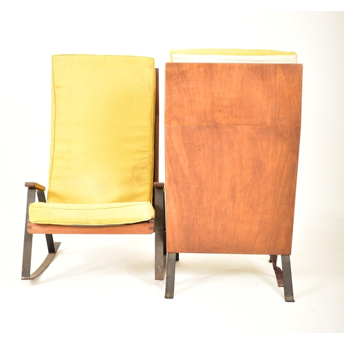 68 - A pair of retro 20th century teak and metal framed lounge chairs / armchairs. One chair being a rock... 