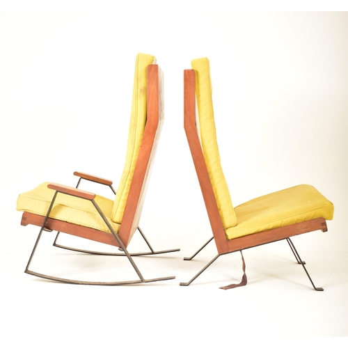 68 - A pair of retro 20th century teak and metal framed lounge chairs / armchairs. One chair being a rock... 