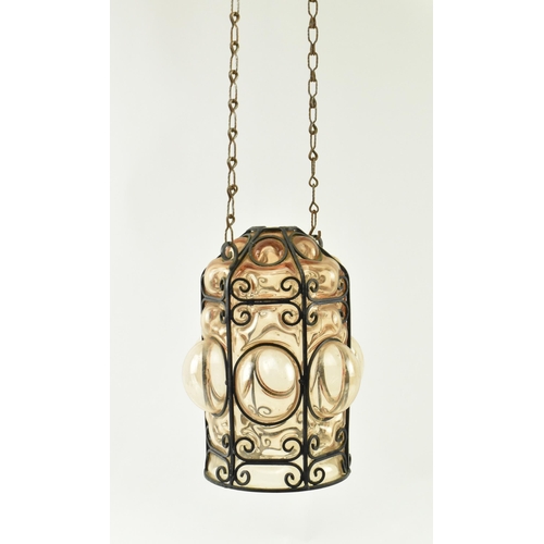 76 - A French inspired early 20th century amber hand blown glass bubble porch lantern light. The lantern ... 