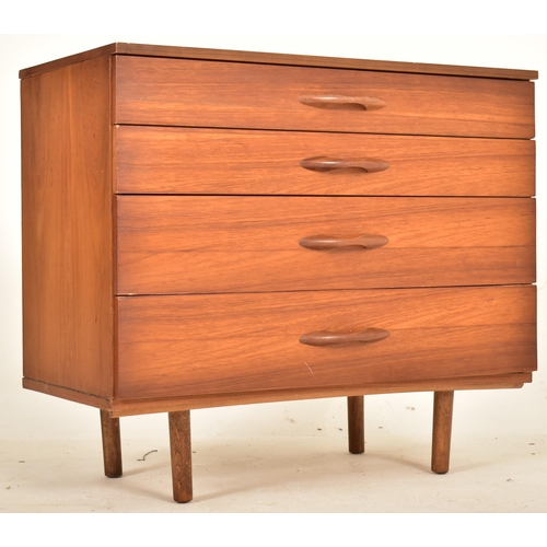 78 - Avalon Furniture - A retro 20th century 1970s designer teak chest of drawers. The chest having a ban... 