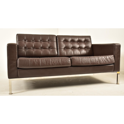 83 - Florence Knoll Style - A contemporary two seater sofa settee. The sofa comprising of brown button ba... 