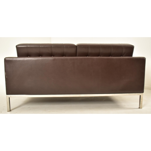 83 - Florence Knoll Style - A contemporary two seater sofa settee. The sofa comprising of brown button ba... 