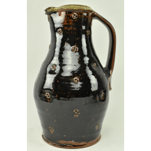 90 - Phil Rogers (1951-2020) - A studio art pottery stoneware glazed pouring jug by Phil Rogers. The jug ... 