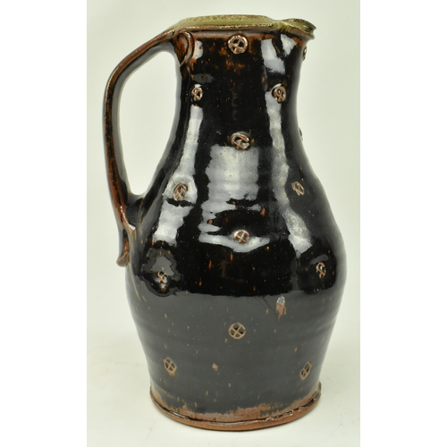 90 - Phil Rogers (1951-2020) - A studio art pottery stoneware glazed pouring jug by Phil Rogers. The jug ... 