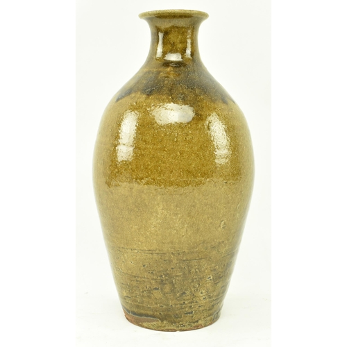 91 - Trevor Corser for Leach Pottery - a vintage 20th century studio pottery vase. The vase of bottle sha... 