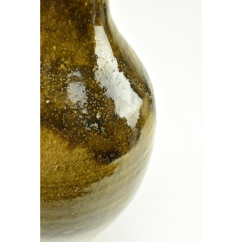 91 - Trevor Corser for Leach Pottery - a vintage 20th century studio pottery vase. The vase of bottle sha... 