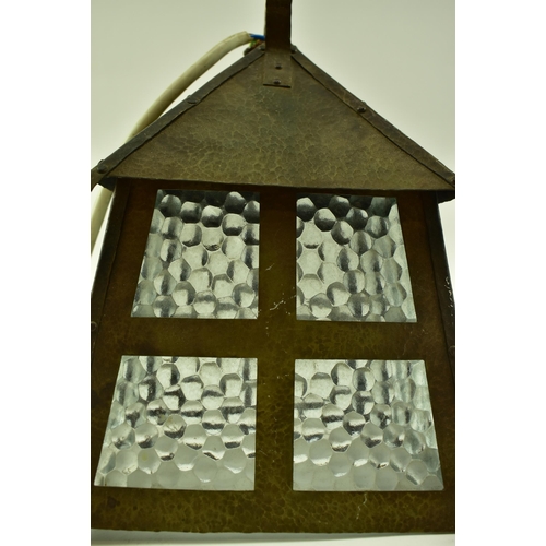 93 - An early 20th century Arts & Crafts hanging porch lantern lamp light. The light of copper constructi... 