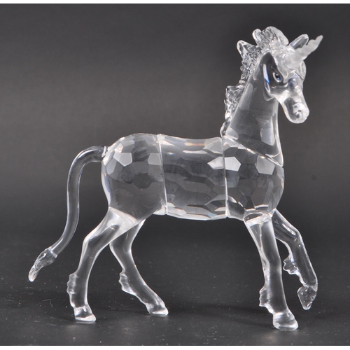 102 - Swarovski - A collection of Swarovski crystal glass decorative animal figures. The collection to inc... 