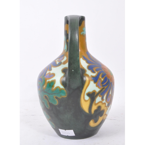 103 - Holland Amphora - An early 20th Century ceramic Holland Amphora twin handle chrisant Art Nouveau bul... 