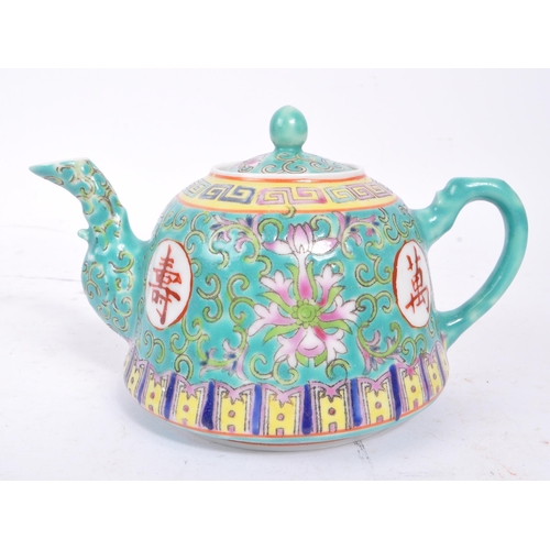 104 - Early 20th Century 1920s vintage porcelain Chinese teapot in blue ground with characters and foliage... 