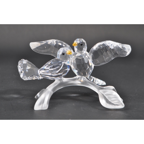 105 - Swarovski - A collection of Swarovski crystal decorative bird figures / ornaments. The collection to... 