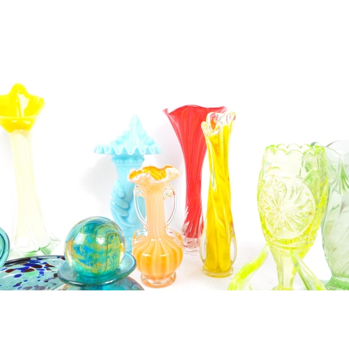 107 - A large collection of 20th Century studio art glass to include uranium glass and makers such as Mdin... 