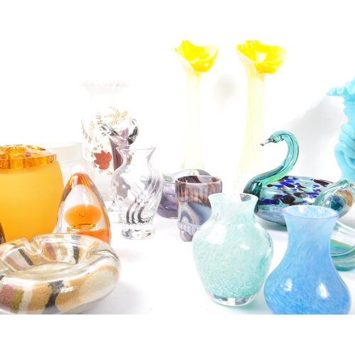 107 - A large collection of 20th Century studio art glass to include uranium glass and makers such as Mdin... 