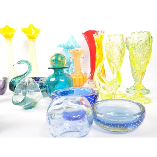 107 - A large collection of 20th Century studio art glass to include uranium glass and makers such as Mdin... 