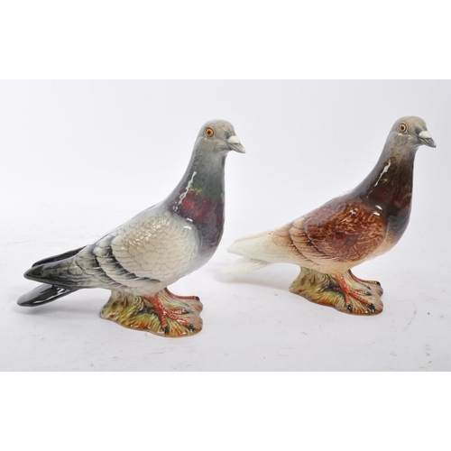 109 - Beswick - Two 20th Century porcelain china Beswick figures in the form of pigeons, both stood on a g... 