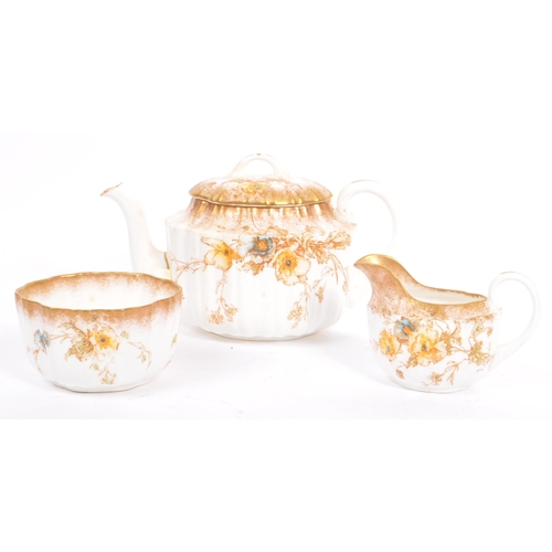 11 - A 19th century porcelain / china Staffordshire tea service. Comprising of teapot, milk jug, sugar bo... 