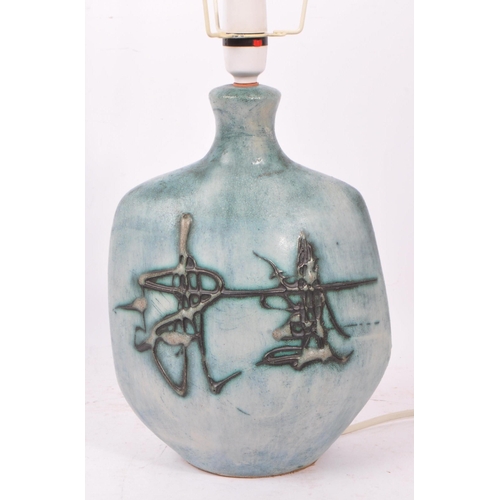 111 - Tremaen Pottery - A 20th Century ceramic Tremaen Cornish pottery lamp in faded blue colour ground wi... 