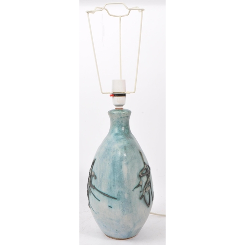 111 - Tremaen Pottery - A 20th Century ceramic Tremaen Cornish pottery lamp in faded blue colour ground wi... 