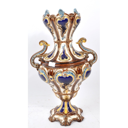 114 - A 19th Century Majolica style porcelain china twin handle German vase in the manner of Wilhelm Schil... 