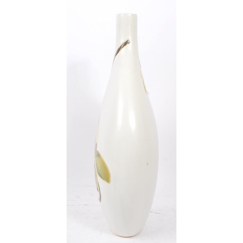 116 - A large 20th Century ceramic studio pottery style vase in bulbous form of white ground with glazed g... 