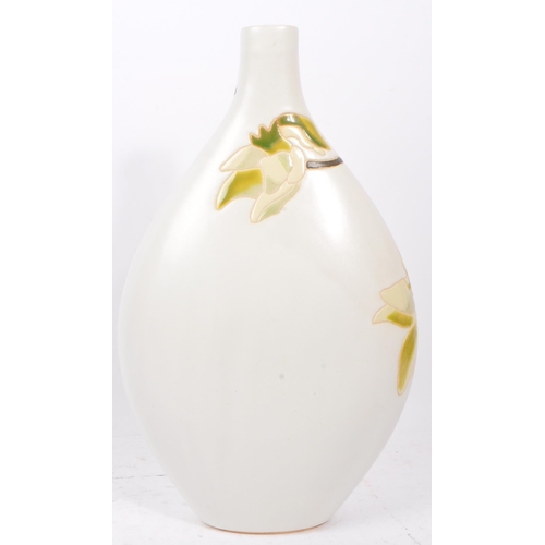 116 - A large 20th Century ceramic studio pottery style vase in bulbous form of white ground with glazed g... 