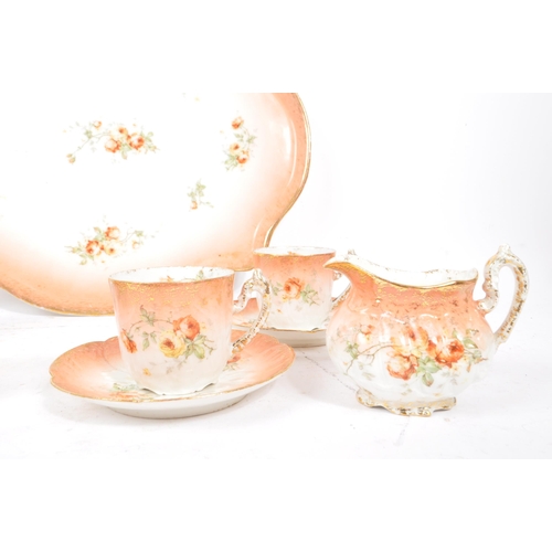 121 - An early 20th Century Edwardian china porcelain breakfast / tea service in blush pink with floral ro... 